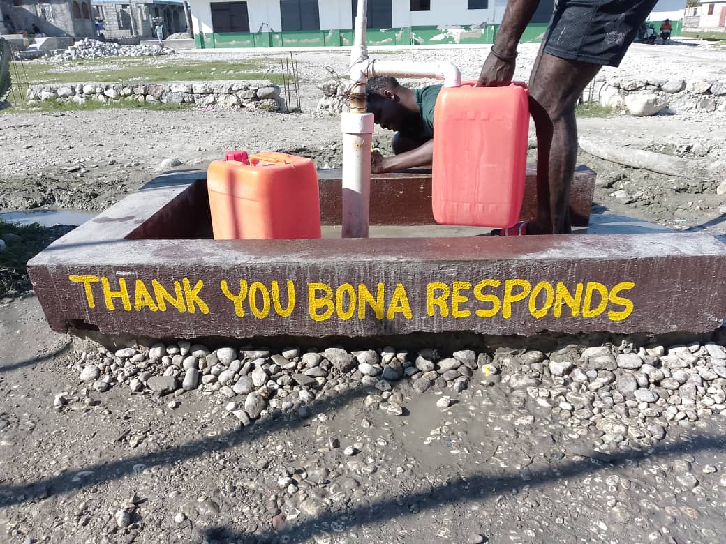 A well in Haiti painted 'THANK YOU BONA RESPONDS.'