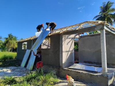 Construction crew rebuilding after a hurricane.